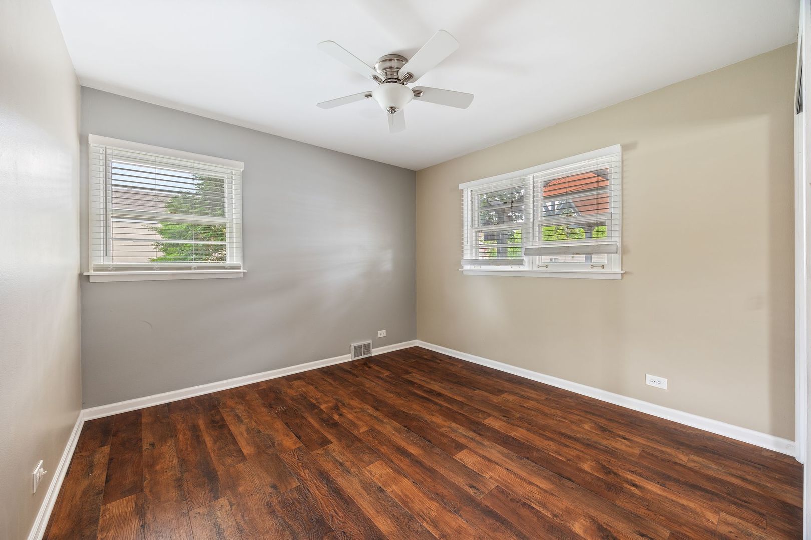 149 Wheeling Avenue Wheeling, IL 60090 - Photo 10 of 23 wooden floor in an empty room with a window