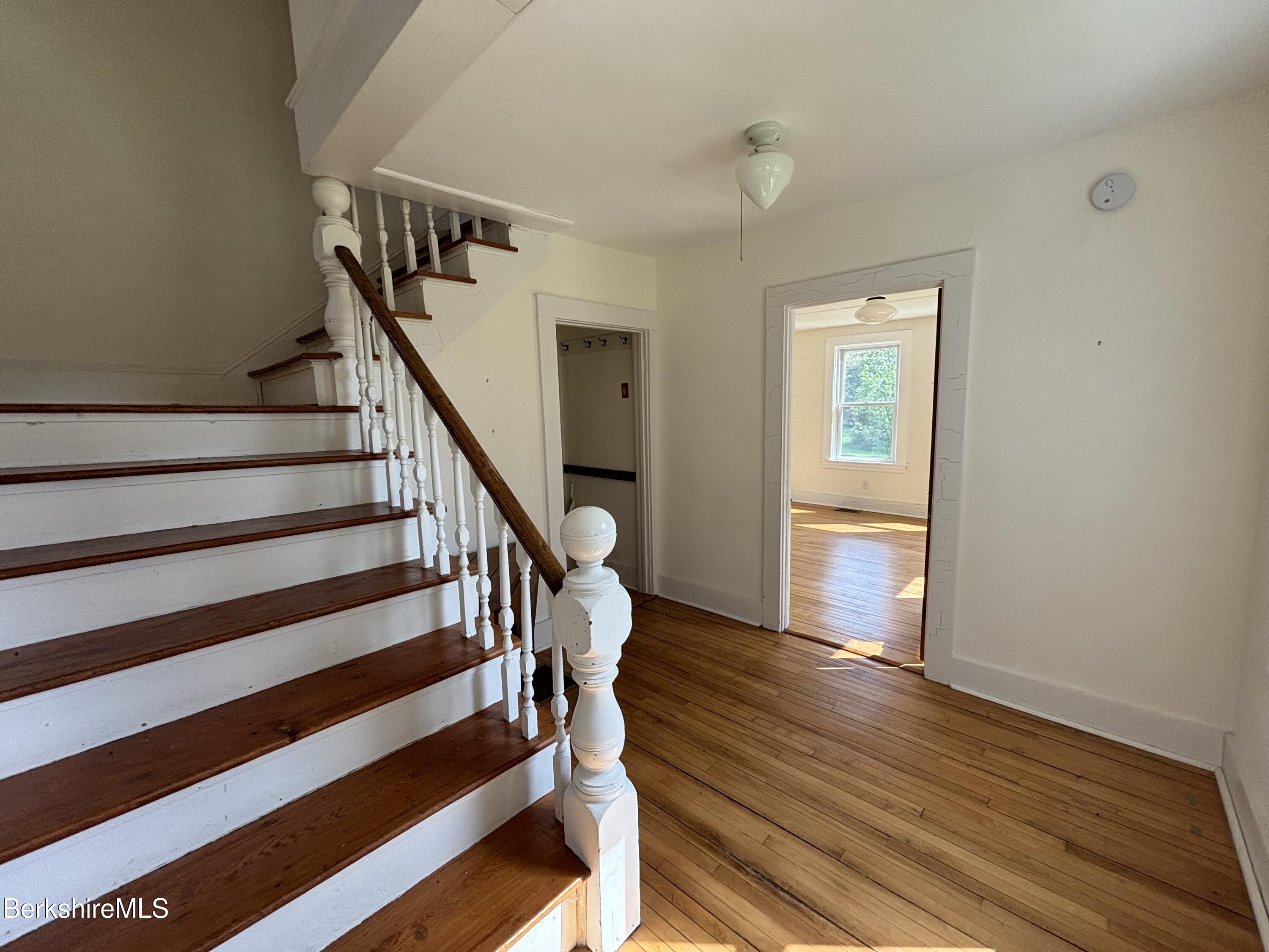 86 Miner Road Lanesborough, MA 01237 - Photo 35 of 44 a view of entryway with wooden floor and stairs