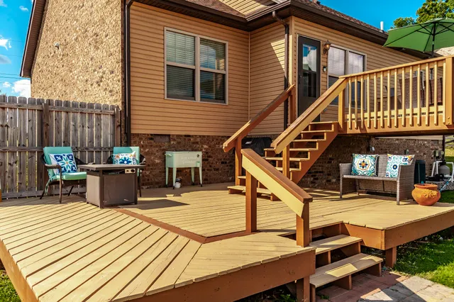 a balcony with furniture and a potted plant