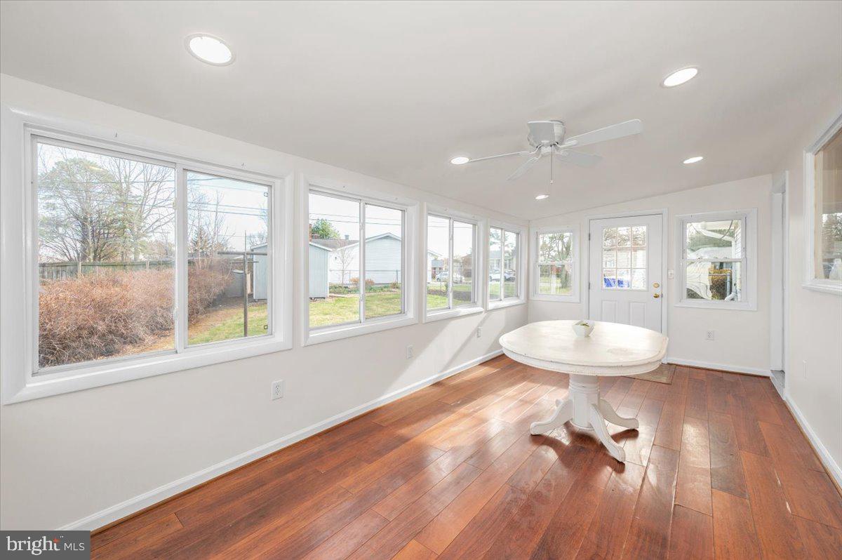 1200 Wilson Place Frederick, MD 21702 - Photo 19 of 57 a living room with wooden floor and a table