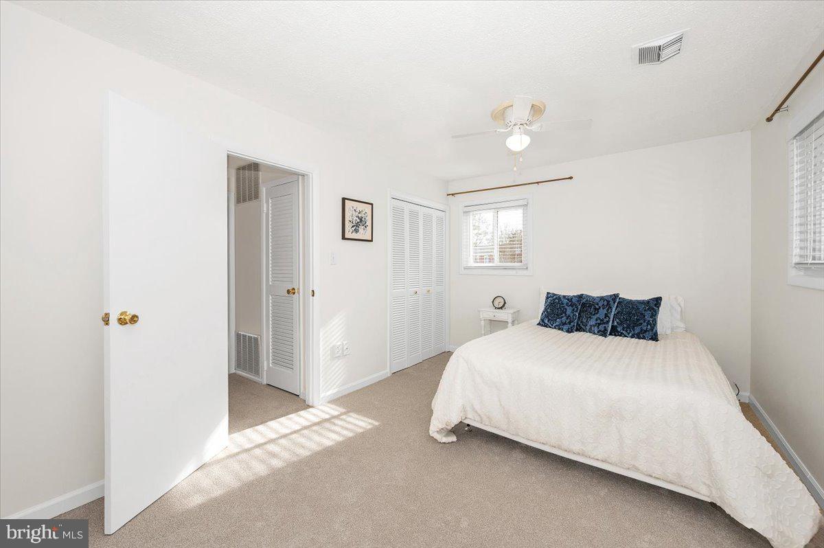 1200 Wilson Place Frederick, MD 21702 - Photo 25 of 57 a bedroom with a bed and a night lamp