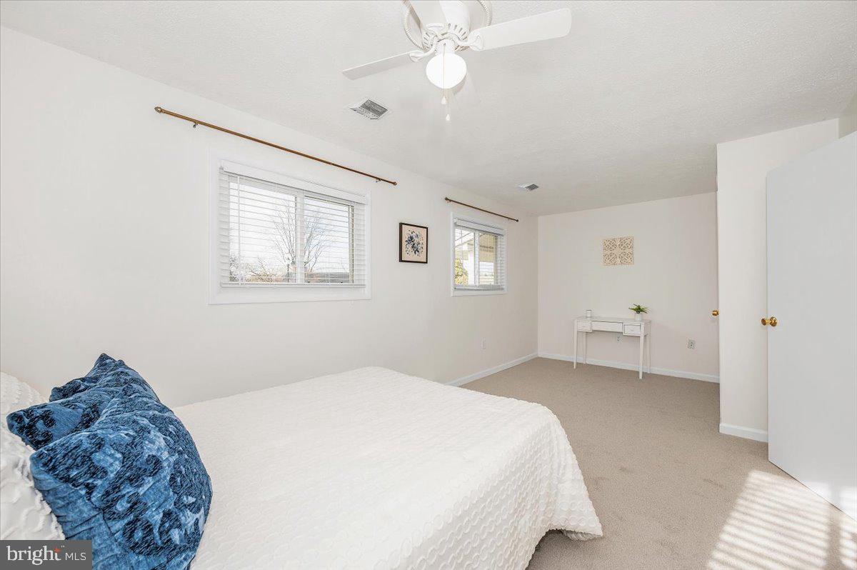 1200 Wilson Place Frederick, MD 21702 - Photo 26 of 57 a spacious bedroom with a bed and a window