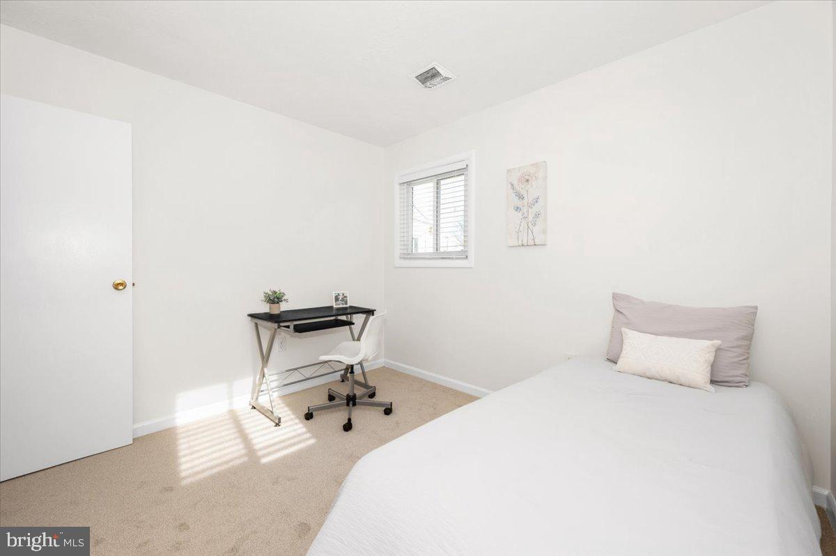 1200 Wilson Place Frederick, MD 21702 - Photo 30 of 57 a bedroom with a bed and a table