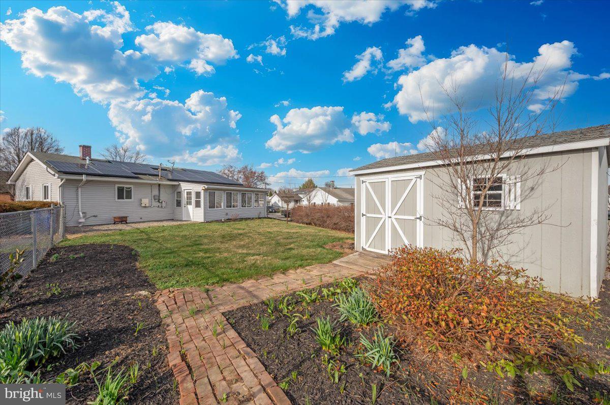 1200 Wilson Place Frederick, MD 21702 - Photo 41 of 57 a front view of a house with garden