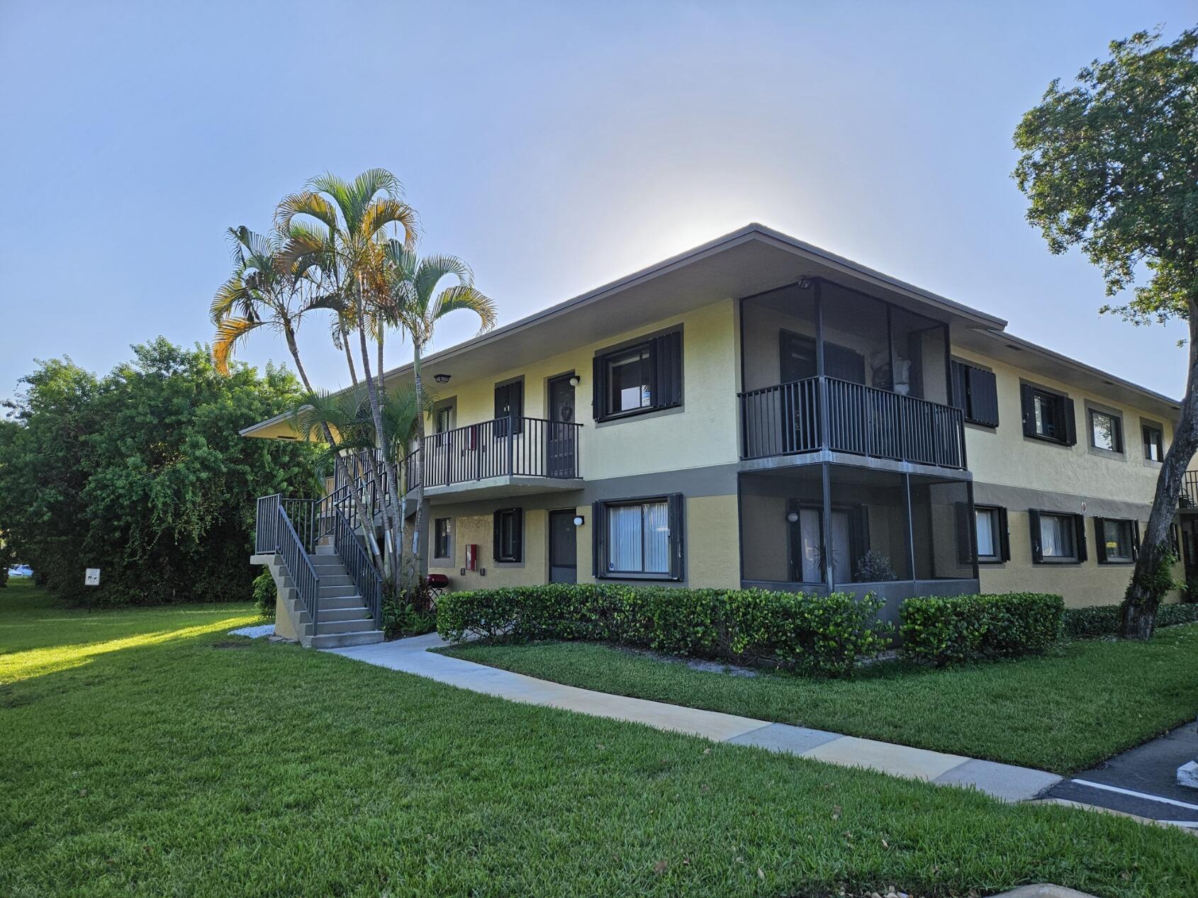 545 Trace Circle, Unit 201 Deerfield Beach, FL 33441 - Photo 21 of 37 TT View of Condo from Parking Lot 2