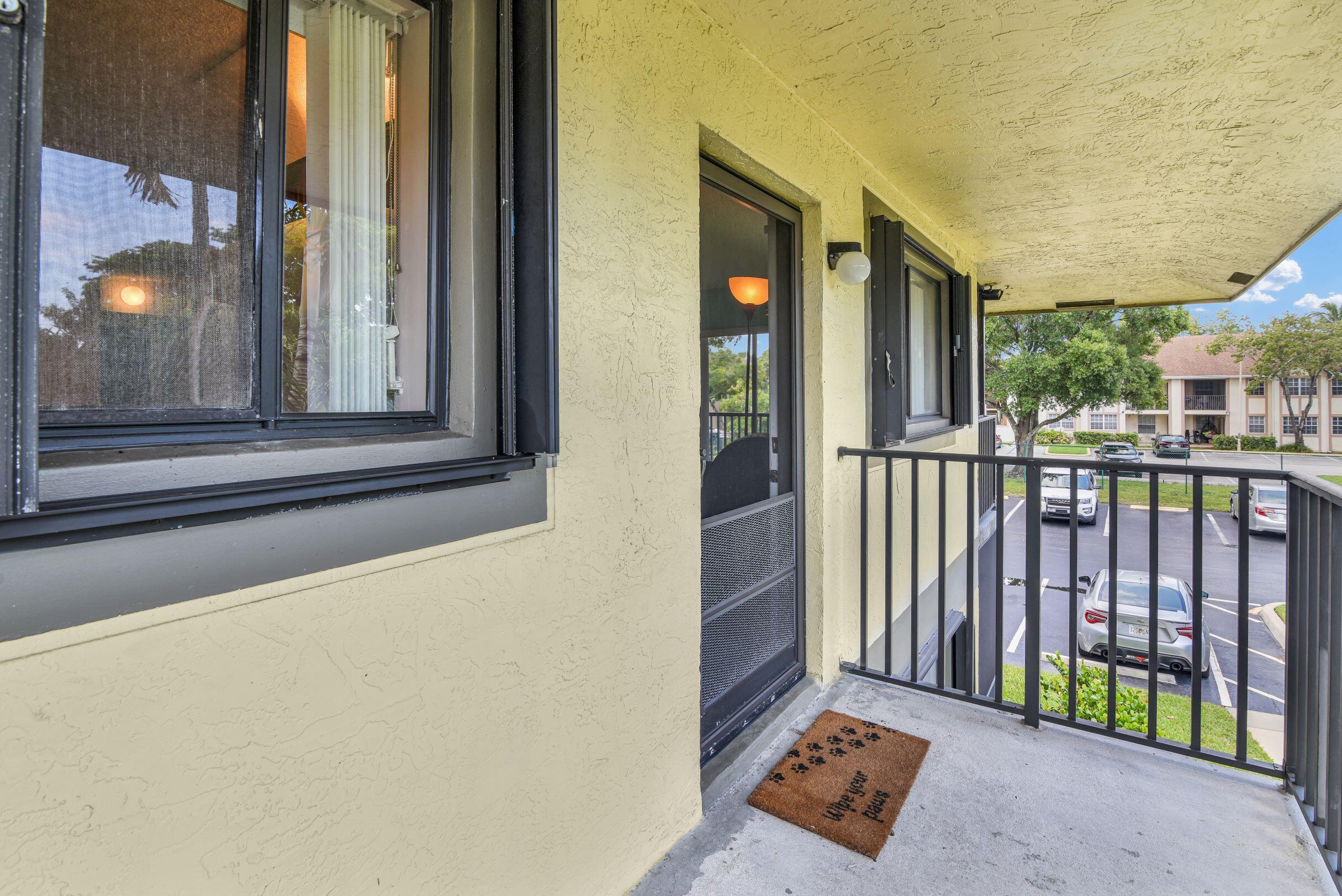 545 Trace Circle, Unit 201 Deerfield Beach, FL 33441 - Photo 22 of 37 Outside of the Front Door