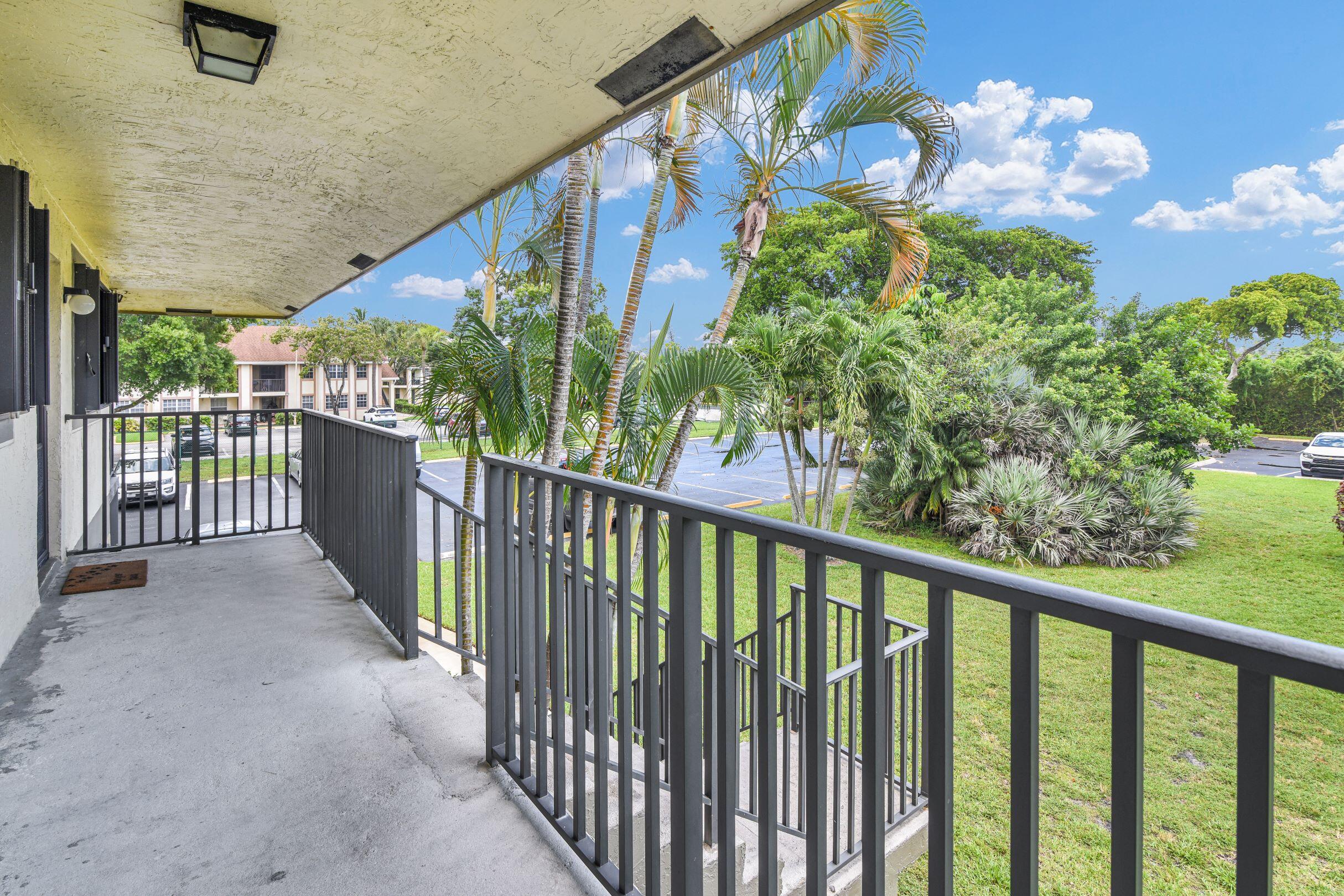 545 Trace Circle, Unit 201 Deerfield Beach, FL 33441 - Photo 23 of 37 Entry Staircase