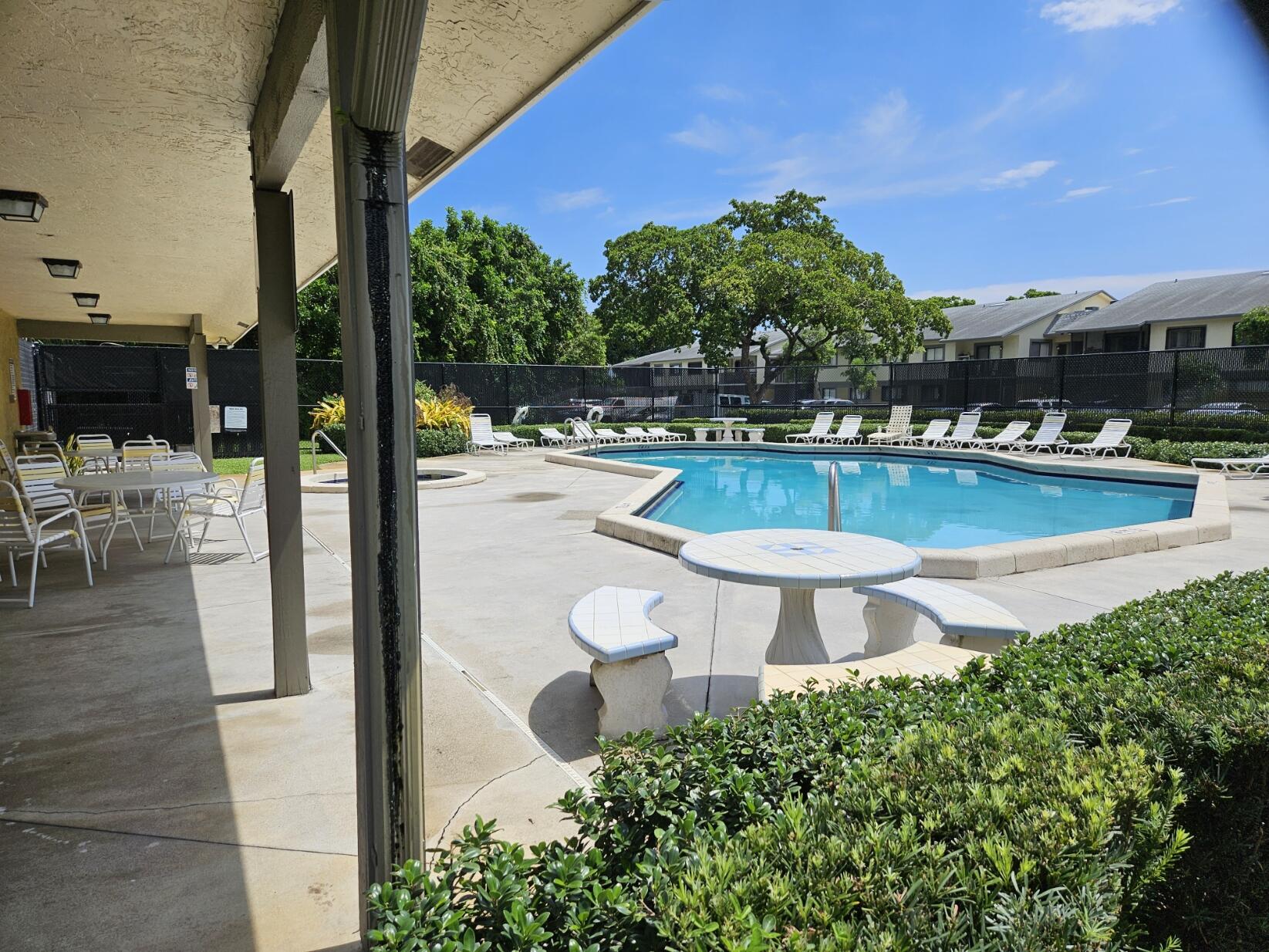 545 Trace Circle, Unit 201 Deerfield Beach, FL 33441 - Photo 31 of 37 TT Pool with covered patio