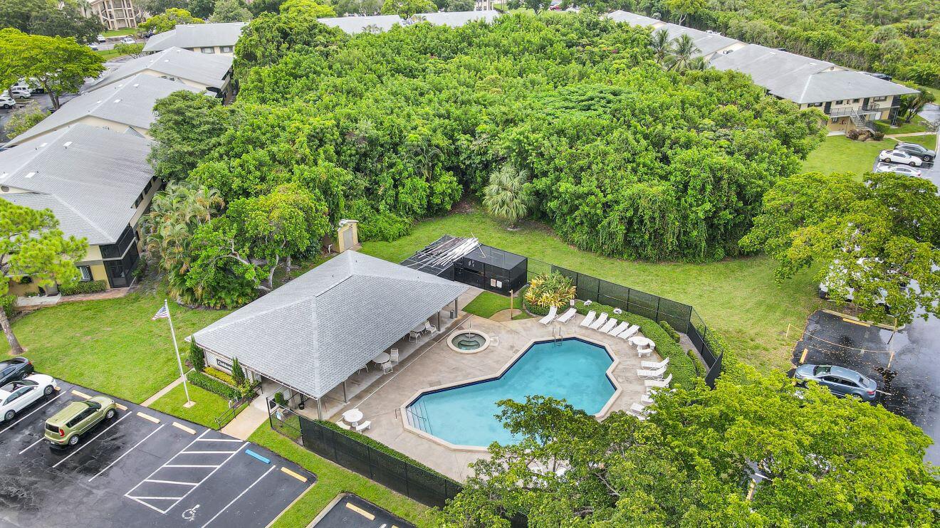 545 Trace Circle, Unit 201 Deerfield Beach, FL 33441 - Photo 35 of 37 Pool and partial Community towards Unit