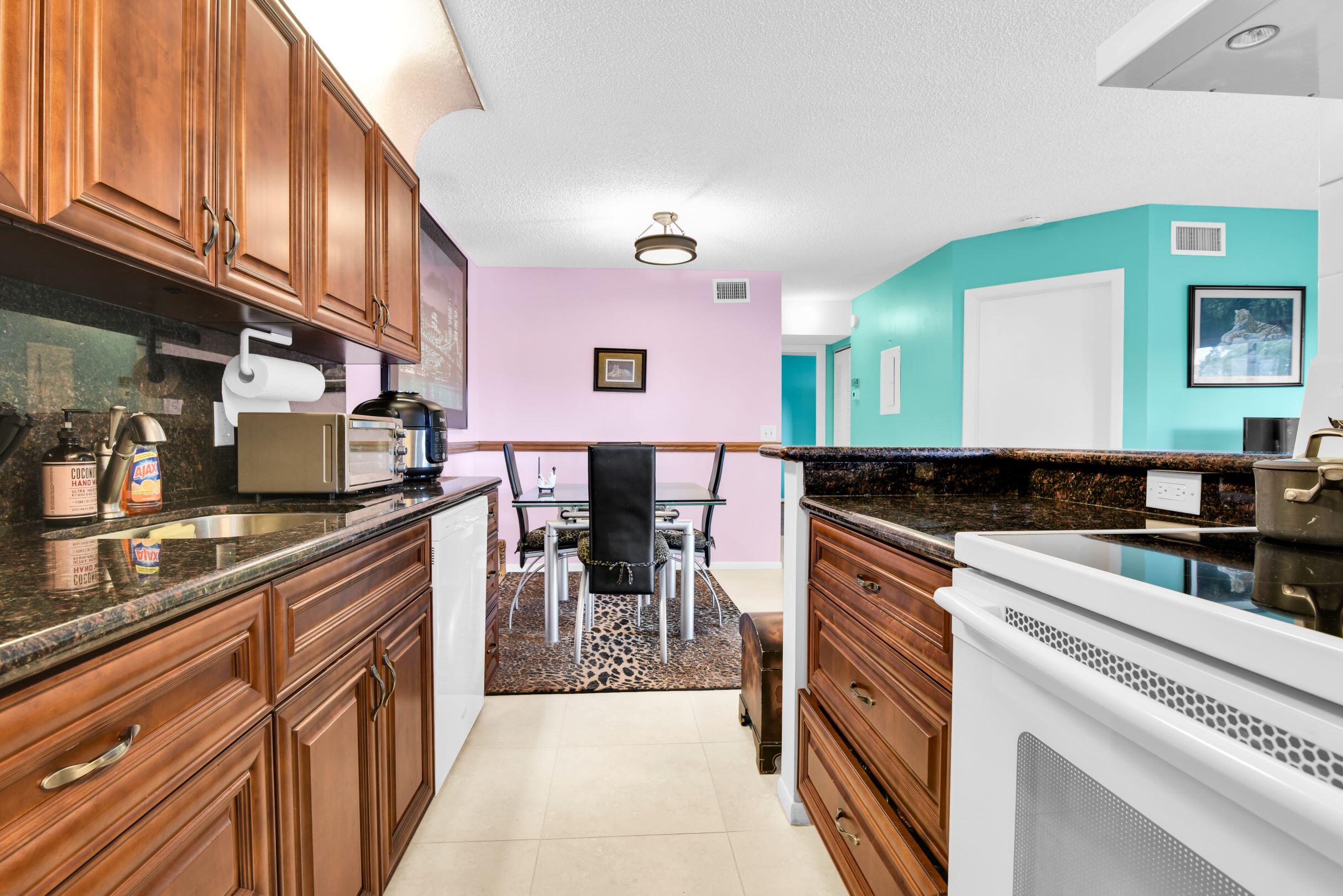 545 Trace Circle, Unit 201 Deerfield Beach, FL 33441 - Photo 6 of 37 View from Kitchen to Dining