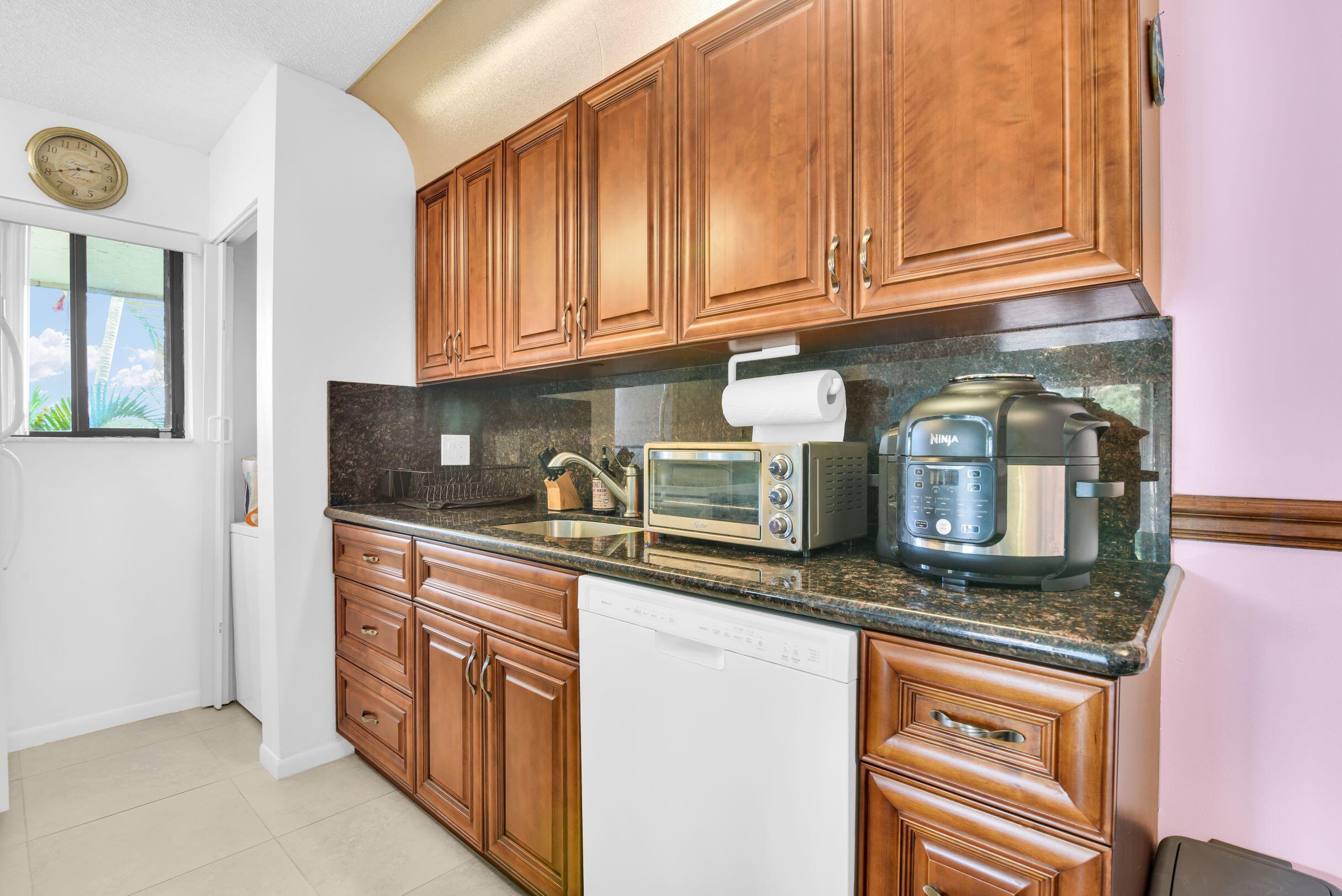 545 Trace Circle, Unit 201 Deerfield Beach, FL 33441 - Photo 7 of 37 Kitchen Back Wall