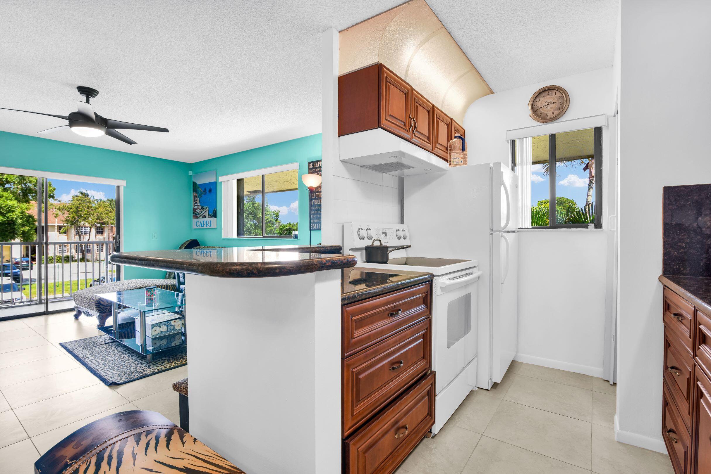 545 Trace Circle, Unit 201 Deerfield Beach, FL 33441 - Photo 8 of 37 View from Dining to Kithcen and Living