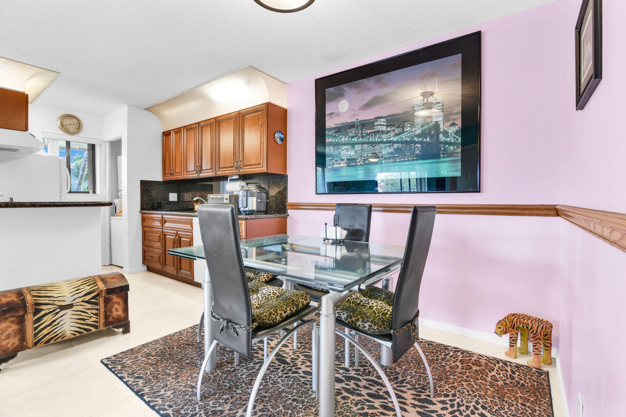 545 Trace Circle, Unit 201 Deerfield Beach, FL 33441 - Photo 10 of 37 View of Dining and Kitchen from Hallway