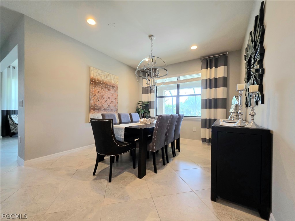 10805 Dennington Road Fort Myers, FL 33913 - Photo 18 of 45 a view of a dining room with furniture and window