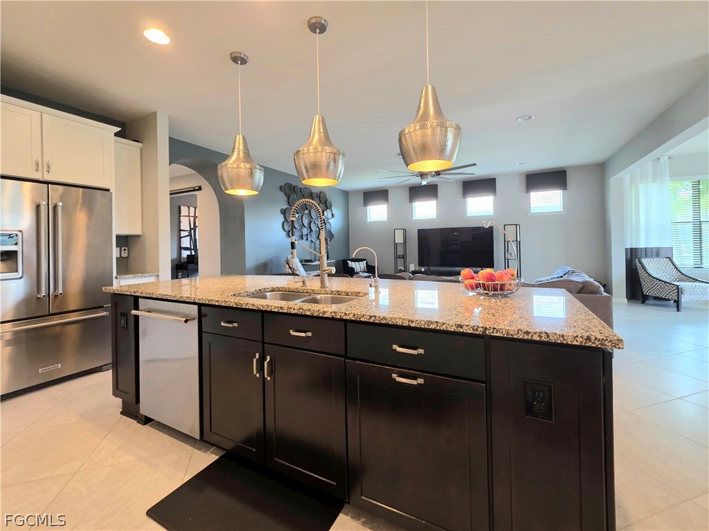 10805 Dennington Road Fort Myers, FL 33913 - Photo 22 of 45 a kitchen with a sink stainless steel appliances and a counter top space