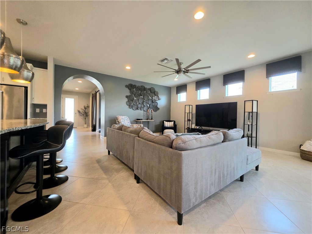 10805 Dennington Road Fort Myers, FL 33913 - Photo 25 of 45 a living room with furniture and a flat screen tv