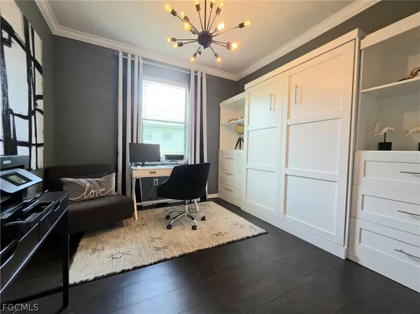 a workspace with furniture and window