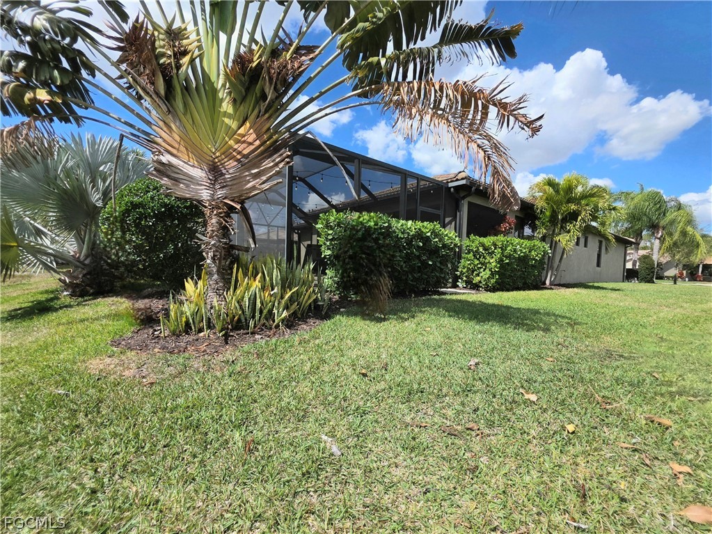 10805 Dennington Road Fort Myers, FL 33913 - Photo 39 of 45 a front view of a house with a yard