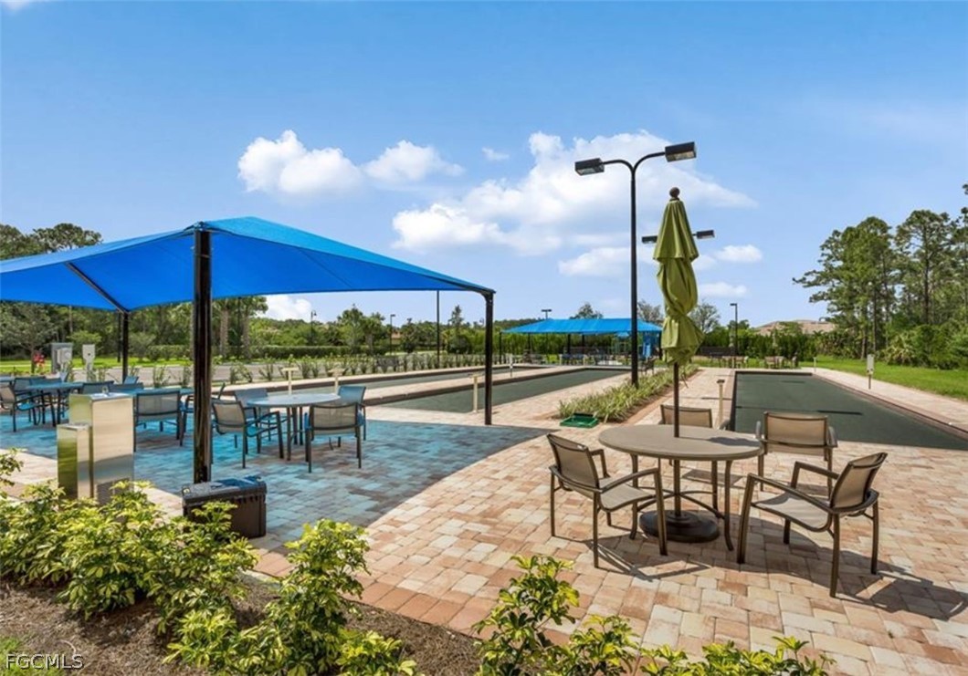 10805 Dennington Road Fort Myers, FL 33913 - Photo 42 of 45 a view of a patio with a table and chairs
