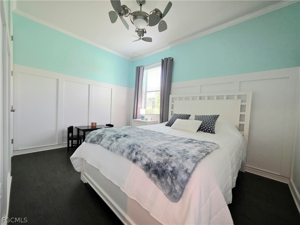 10805 Dennington Road Fort Myers, FL 33913 - Photo 5 of 45 a bed sitting in a spacious bedroom next to a window