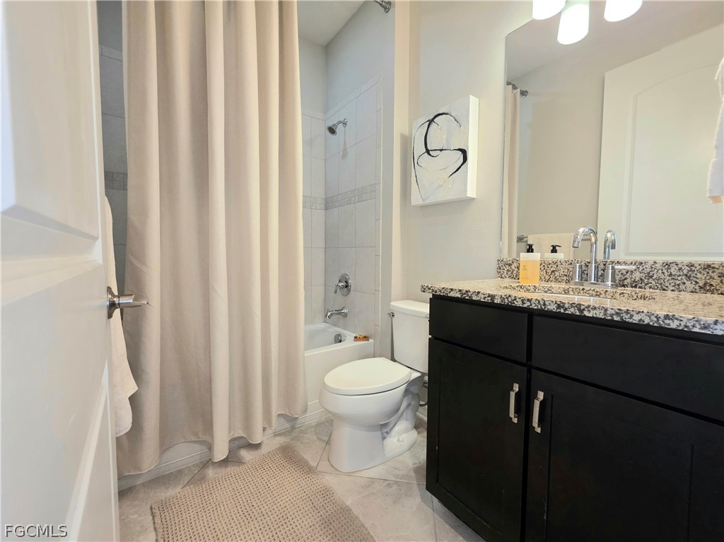 10805 Dennington Road Fort Myers, FL 33913 - Photo 6 of 45 a bathroom with a granite countertop sink toilet and shower