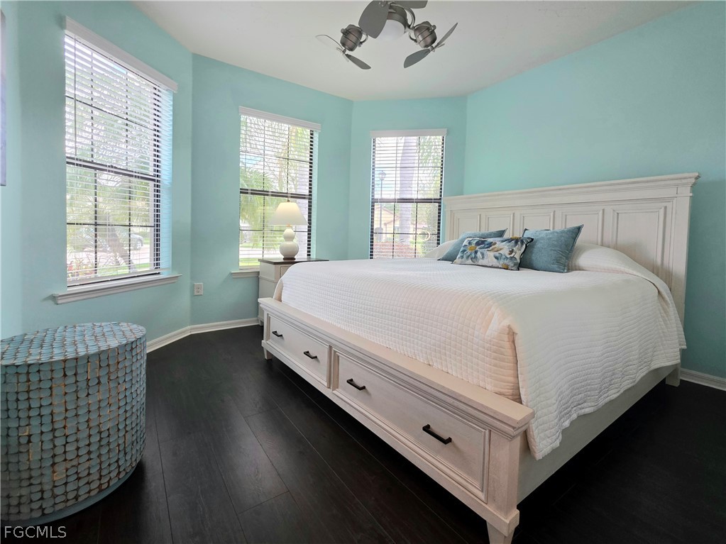 10805 Dennington Road Fort Myers, FL 33913 - Photo 7 of 45 a bedroom with a bed and window