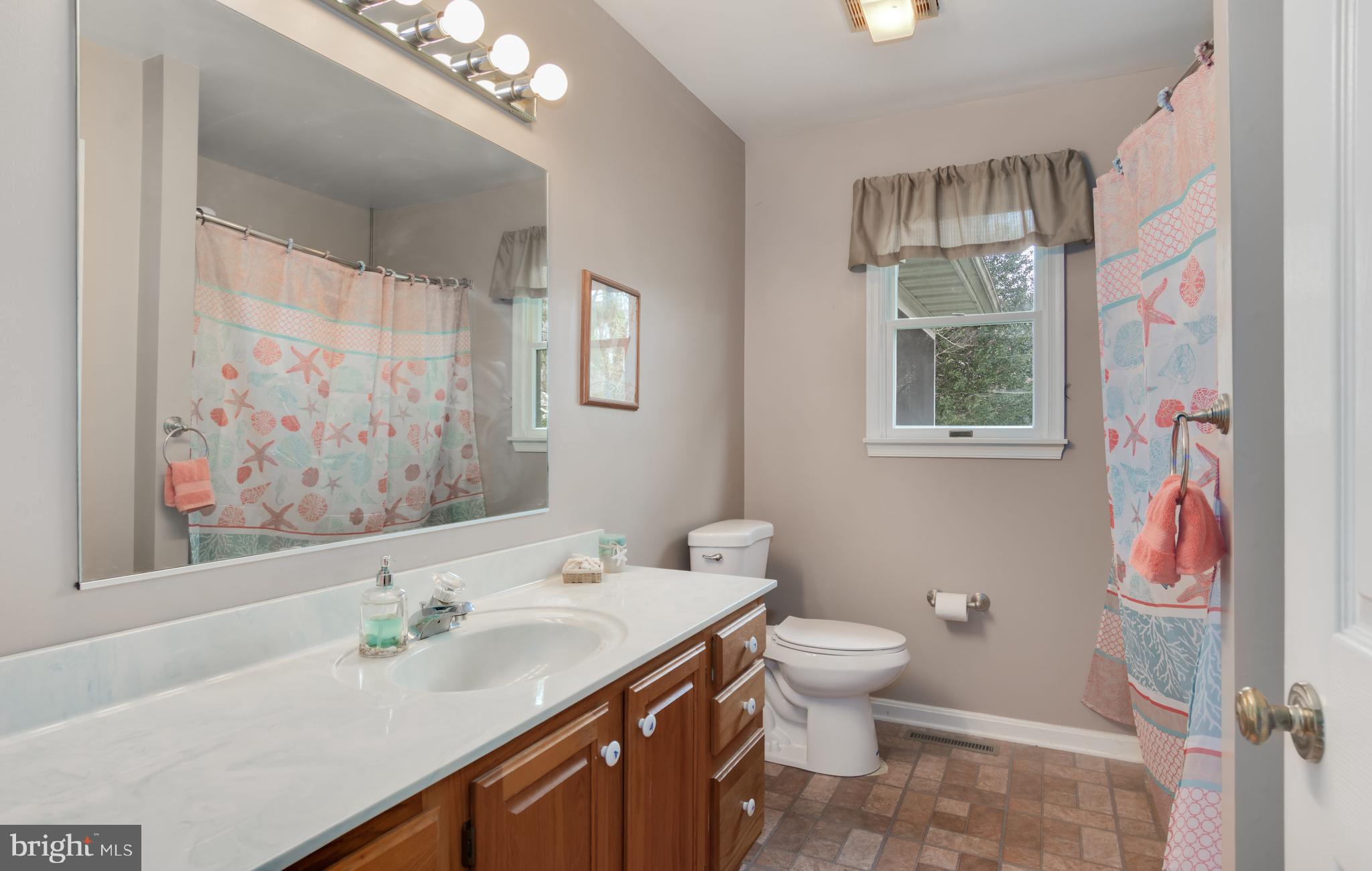 525 Love Point Road Stevensville, MD 21666 - Photo 12 of 30 Full Bath Hallway (New Toilet)