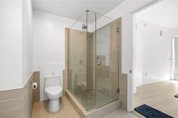 a bedroom with a bed and a table