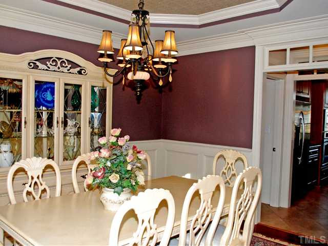 9004 Chelsea Drive Raleigh, NC 27603 - Photo 3 of 25 Formal Dining Room w/ Trey Ceiling Wains Cotting Moulding & Hardwoods! Dining Room
