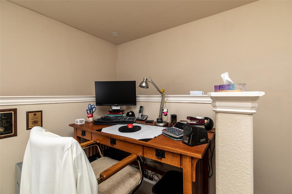 3118 Bedford Road Bedford, TX 76021 - Photo 26 of 29 Dedicated workspace featuring a built-in desk with paneled detailing, neutral-toned walls, recessed lighting, and decorative crown molding