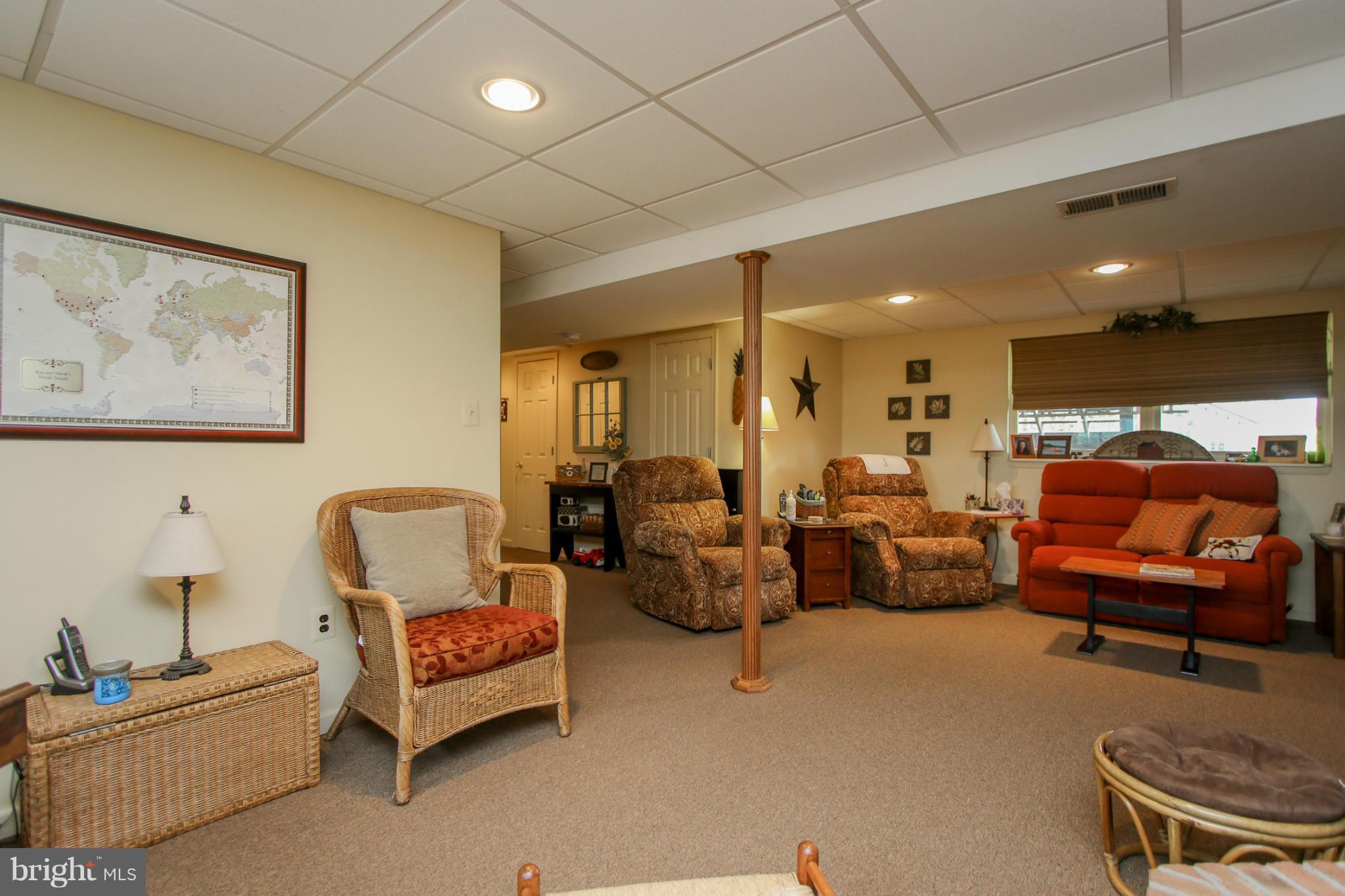 1045 Muller Road Westminster, MD 21157 - Photo 22 of 29 a living room with furniture and a lamp