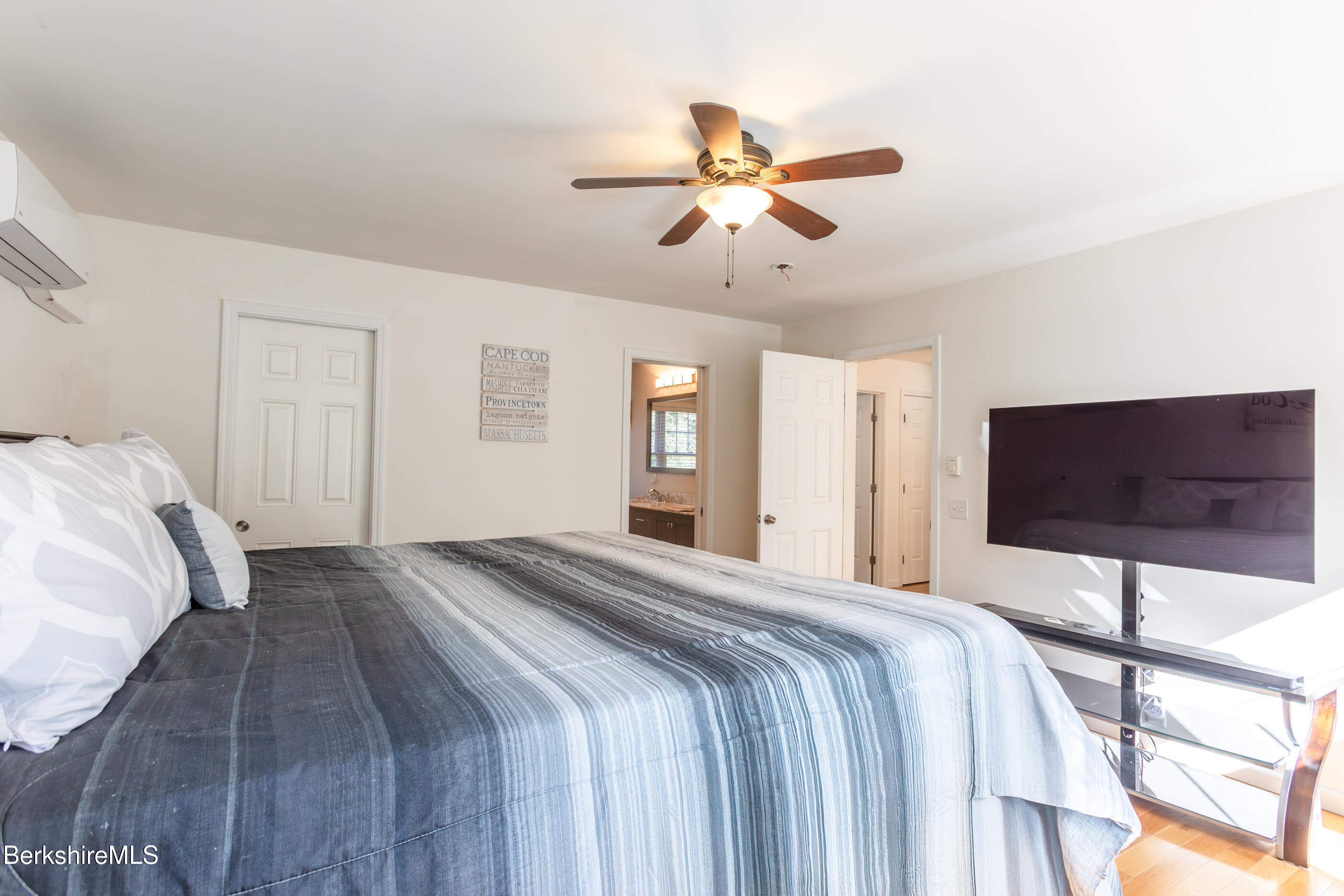 60 Middlefield Road Washington, MA 01223 - Photo 42 of 55 a bedroom with a bed and a flat screen tv