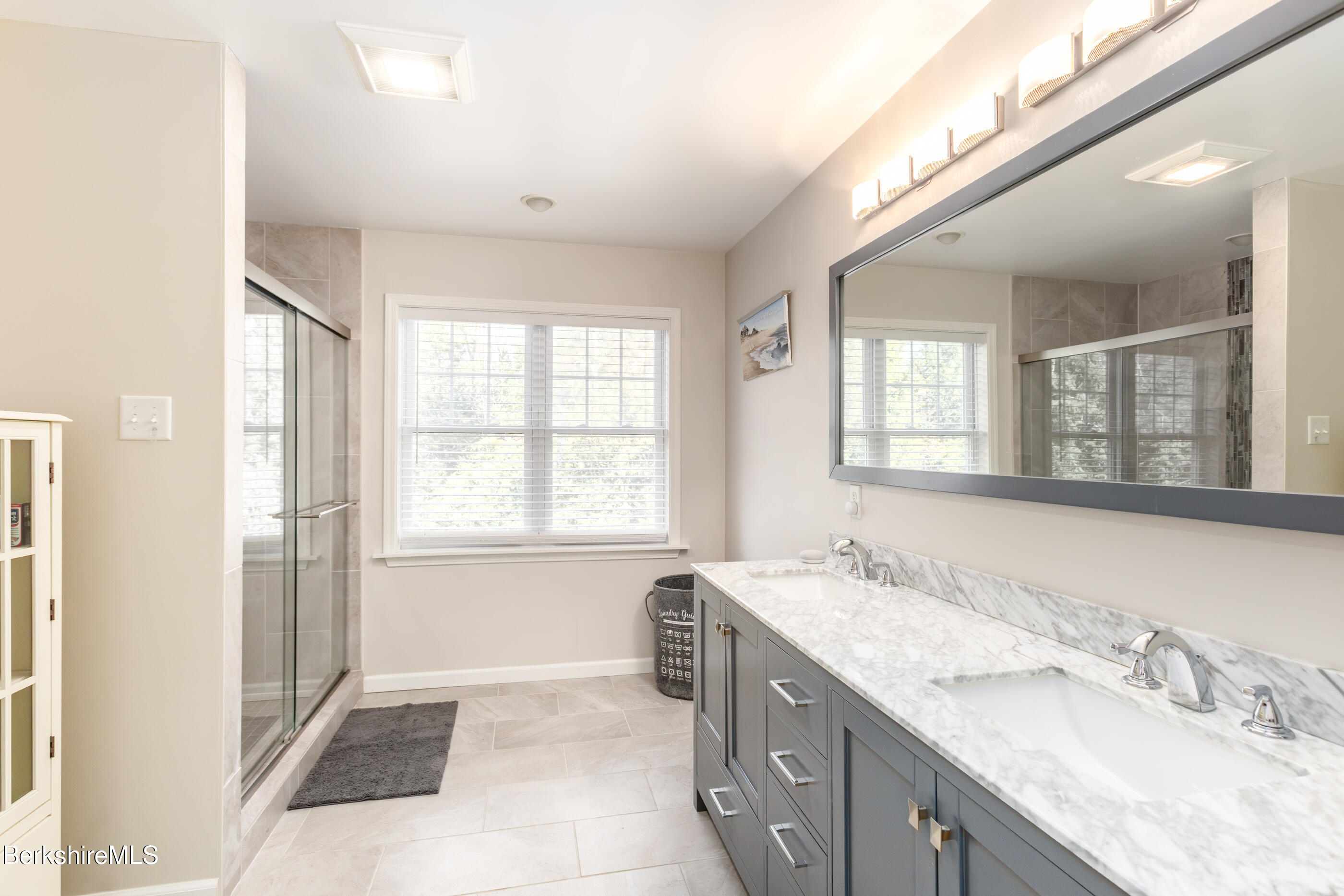 60 Middlefield Road Washington, MA 01223 - Photo 44 of 55 a spacious bathroom with a granite countertop double vanity and a mirror
