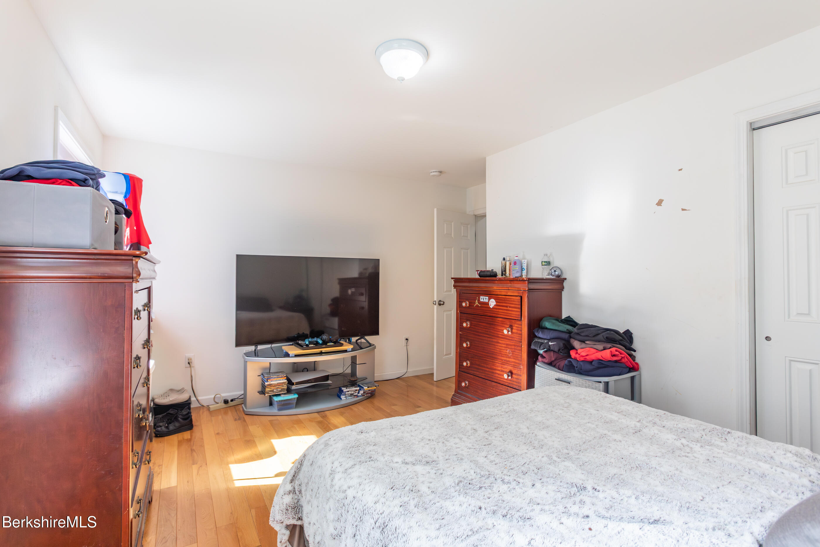 60 Middlefield Road Washington, MA 01223 - Photo 48 of 55 a bedroom with a bed and gym equipment