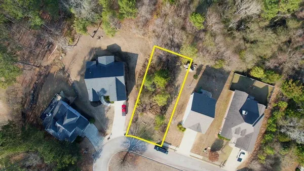 an aerial view of houses with yard
