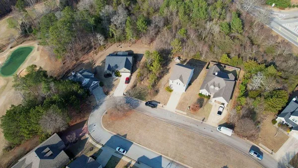 an aerial view of residential house with outdoor space