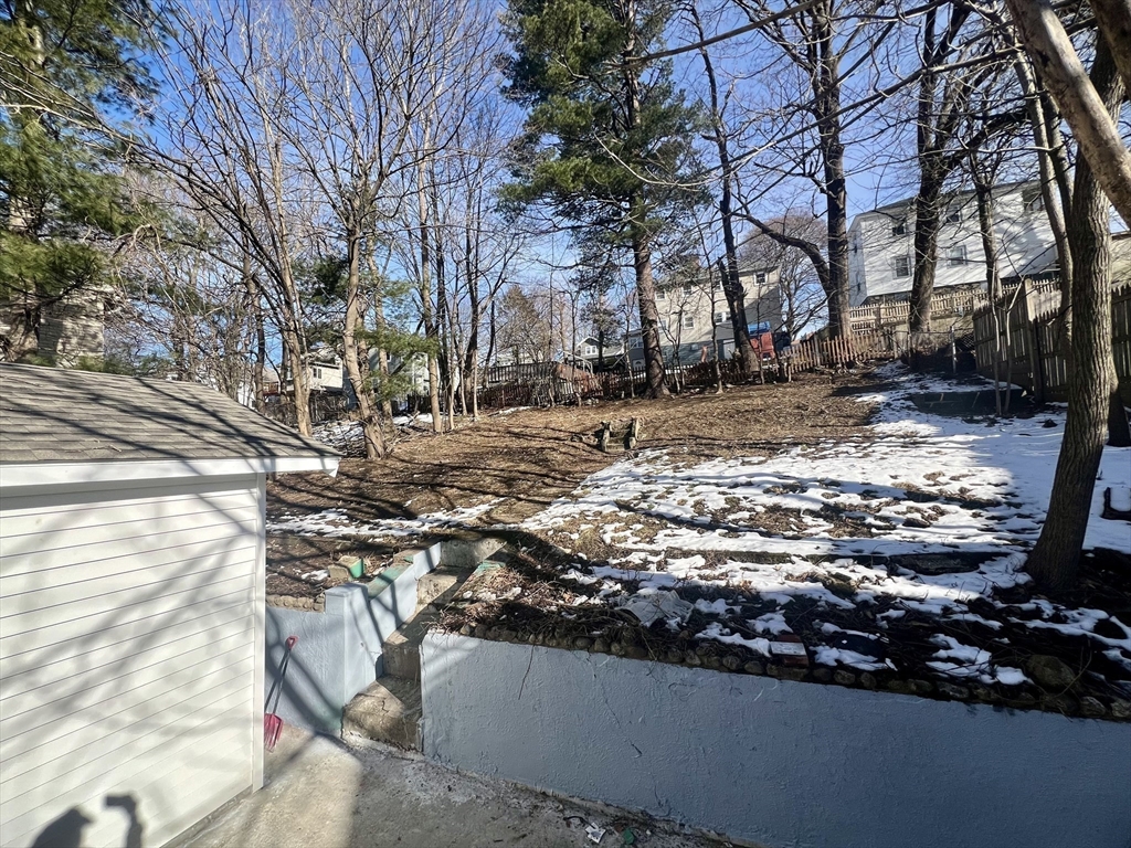24 Proctor Street Worcester, MA 01606 - Photo 24 of 25 a view of a yard with wooden fence
