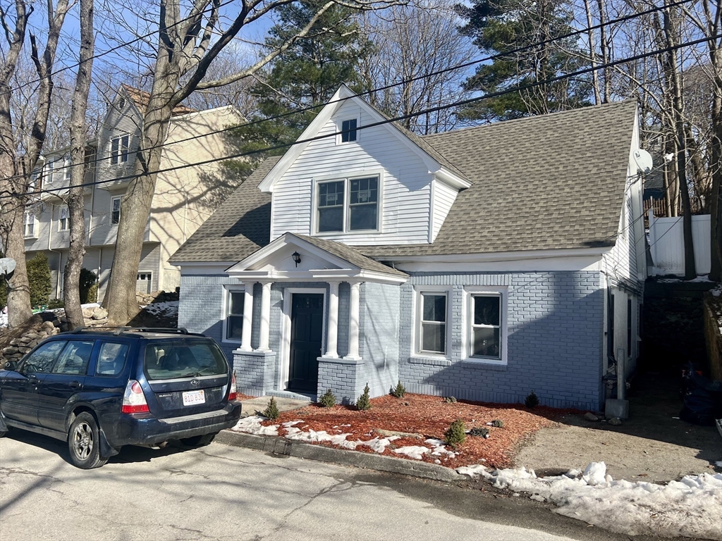 24 Proctor Street Worcester, MA 01606 - Photo 3 of 25 a front view of a house with a yard