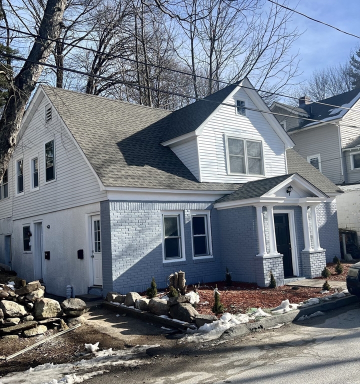 24 Proctor Street Worcester, MA 01606 - Photo 4 of 25 a front view of a house with yard