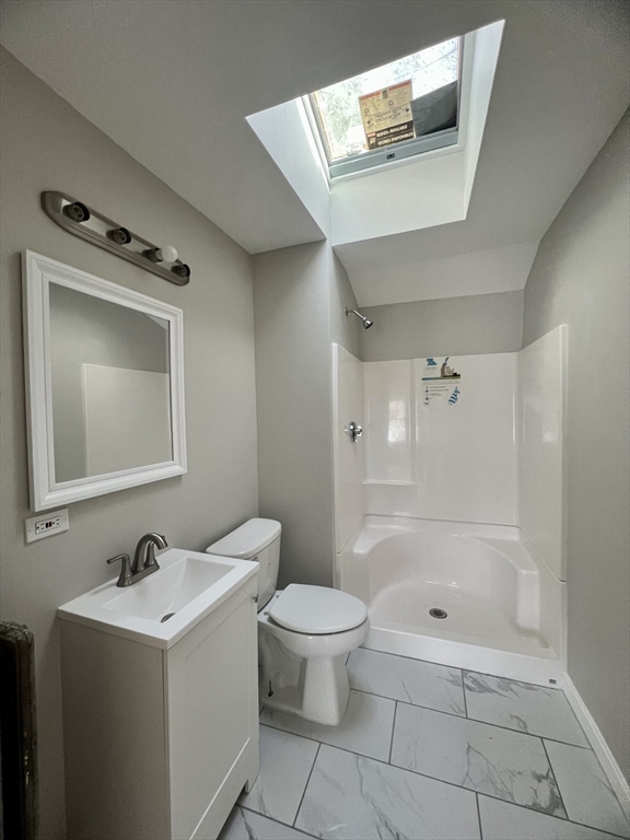 24 Proctor Street Worcester, MA 01606 - Photo 7 of 25 a bathroom with a sink a toilet and shower