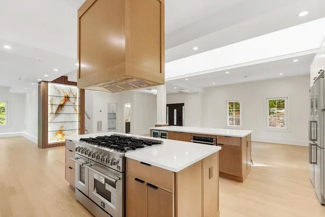 a kitchen that has a stove and a table