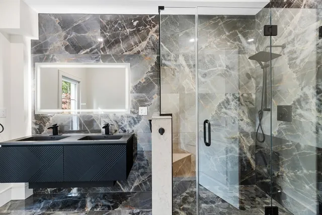 a bathroom with a sink and mirror