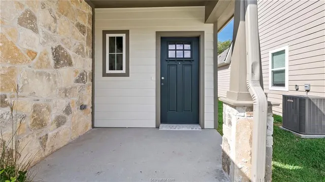 a view of a house with a street