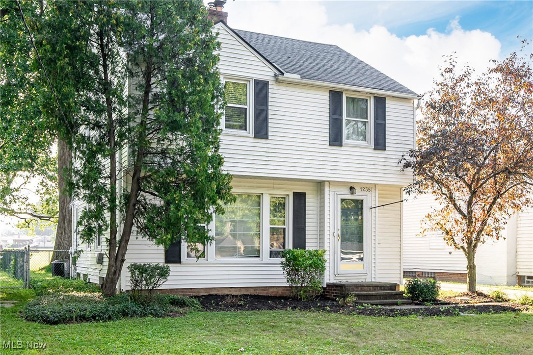 1235 Dorsh Road Cleveland, OH 44121 - Photo 3 of 39 Colonial inspired home featuring a chimney and roof with shingles