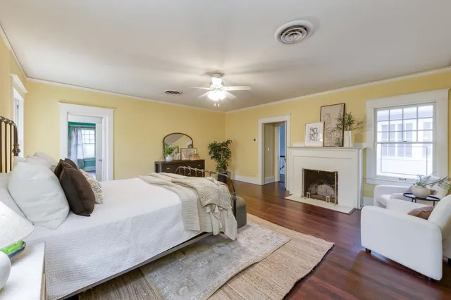 a room with a black white checkered floor with a gaming machine and dining room view