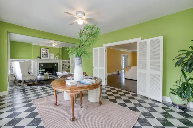 a living room with furniture and a fireplace