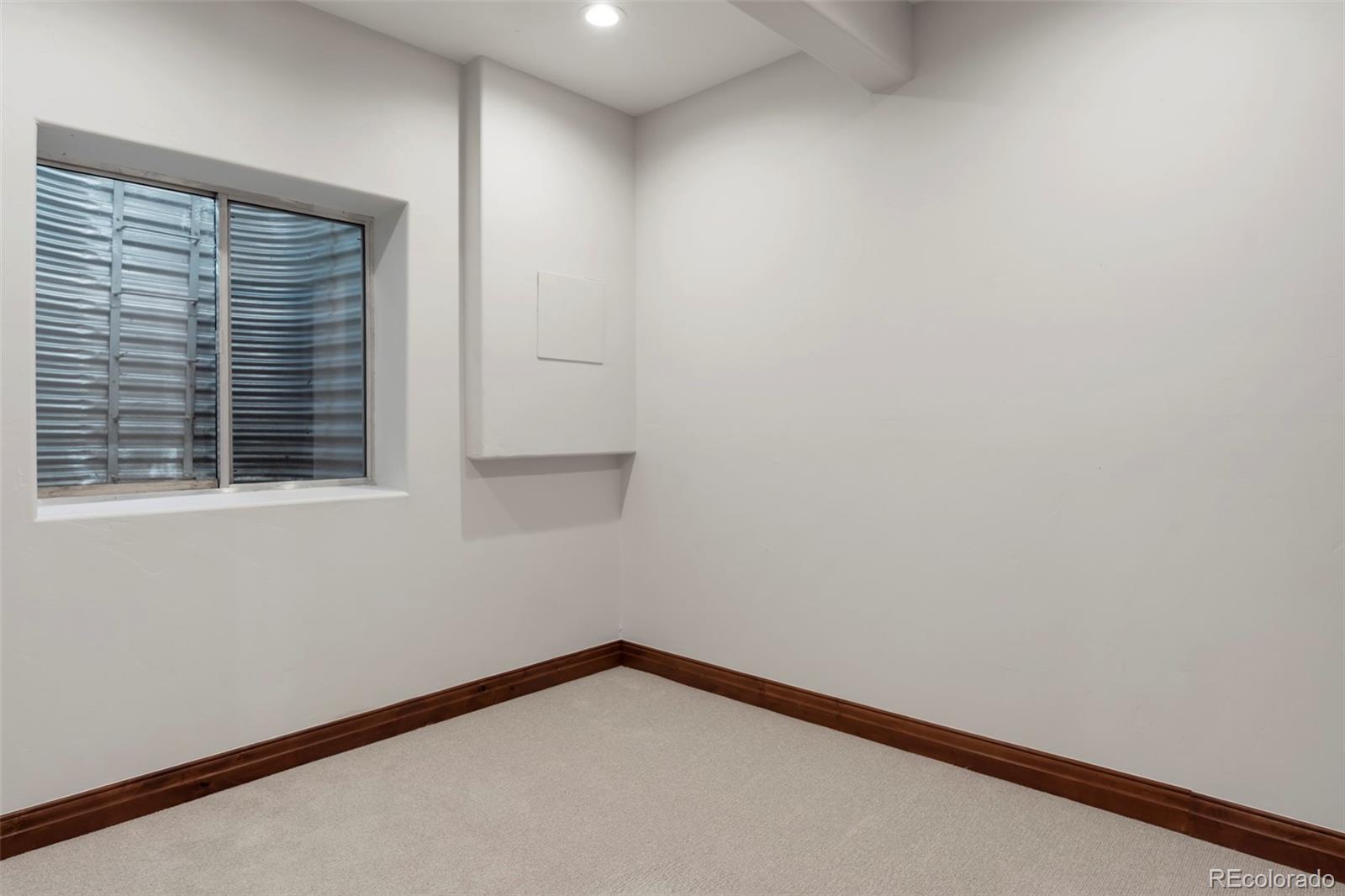 1026 South Cook Street Denver, CO 80209 - Photo 32 of 34 a view of a small space with wooden floor and a window