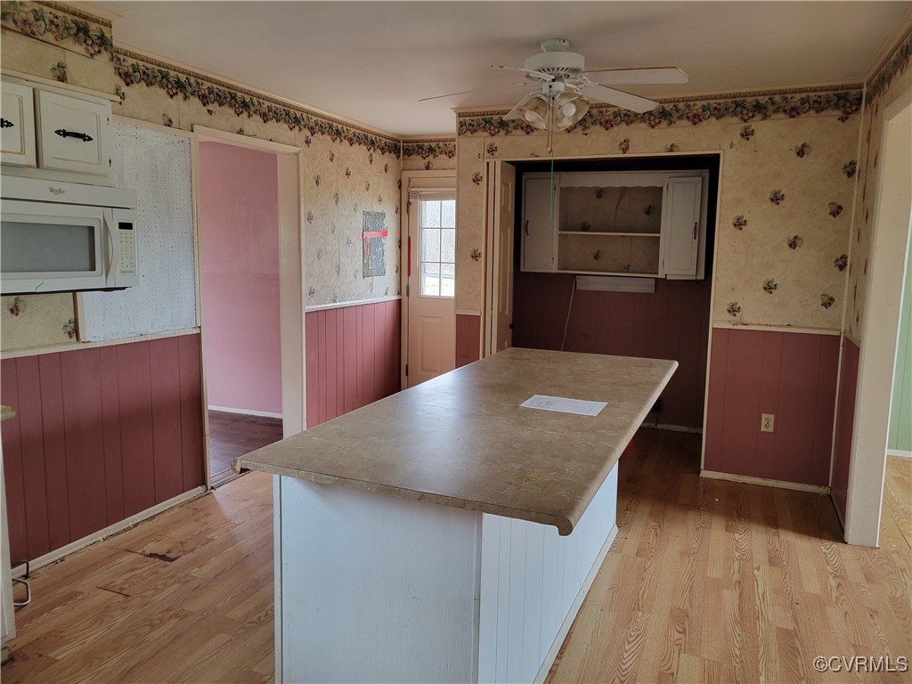 726 Courthouse Drive Saluda, VA 23149 - Photo 6 of 13 Kitchen featuring light wood-type flooring, a wain