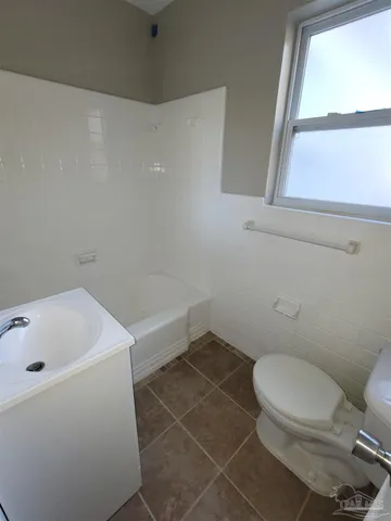 a bathroom with a toilet and a sink