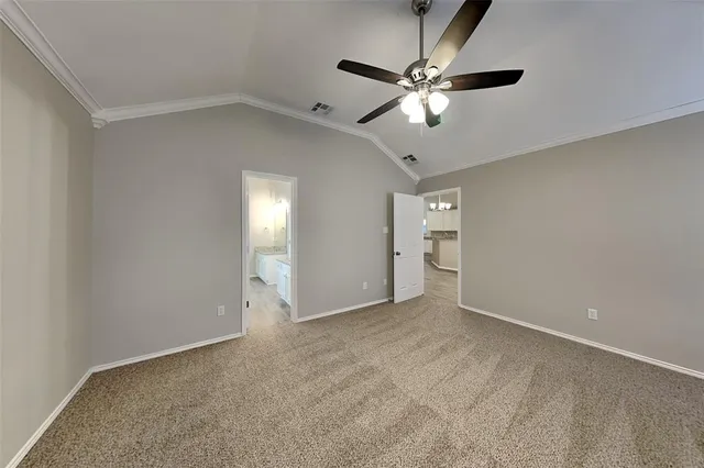 a view of an empty room with a fan
